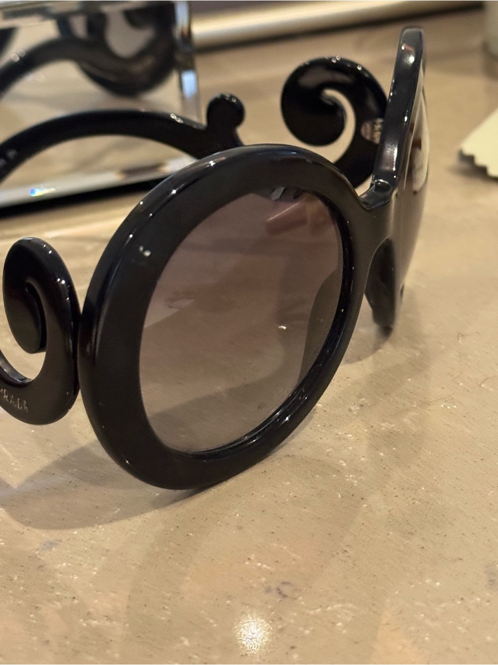 Prada Black Round Sunglasses with Swirl Arms